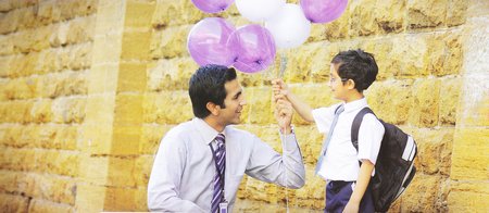 School Student Holding Balloons 